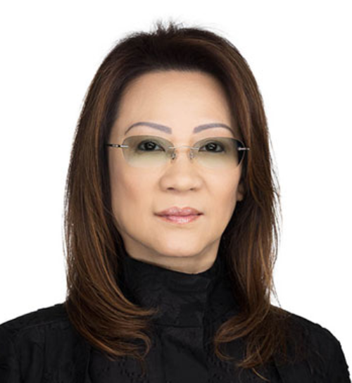 A professional headshot of an East Asian woman with shoulder-length dark brown hair, looking directly forward against a plain white background. She is wearing rimless glasses with slightly tinted lenses and a black high-collared shirt.